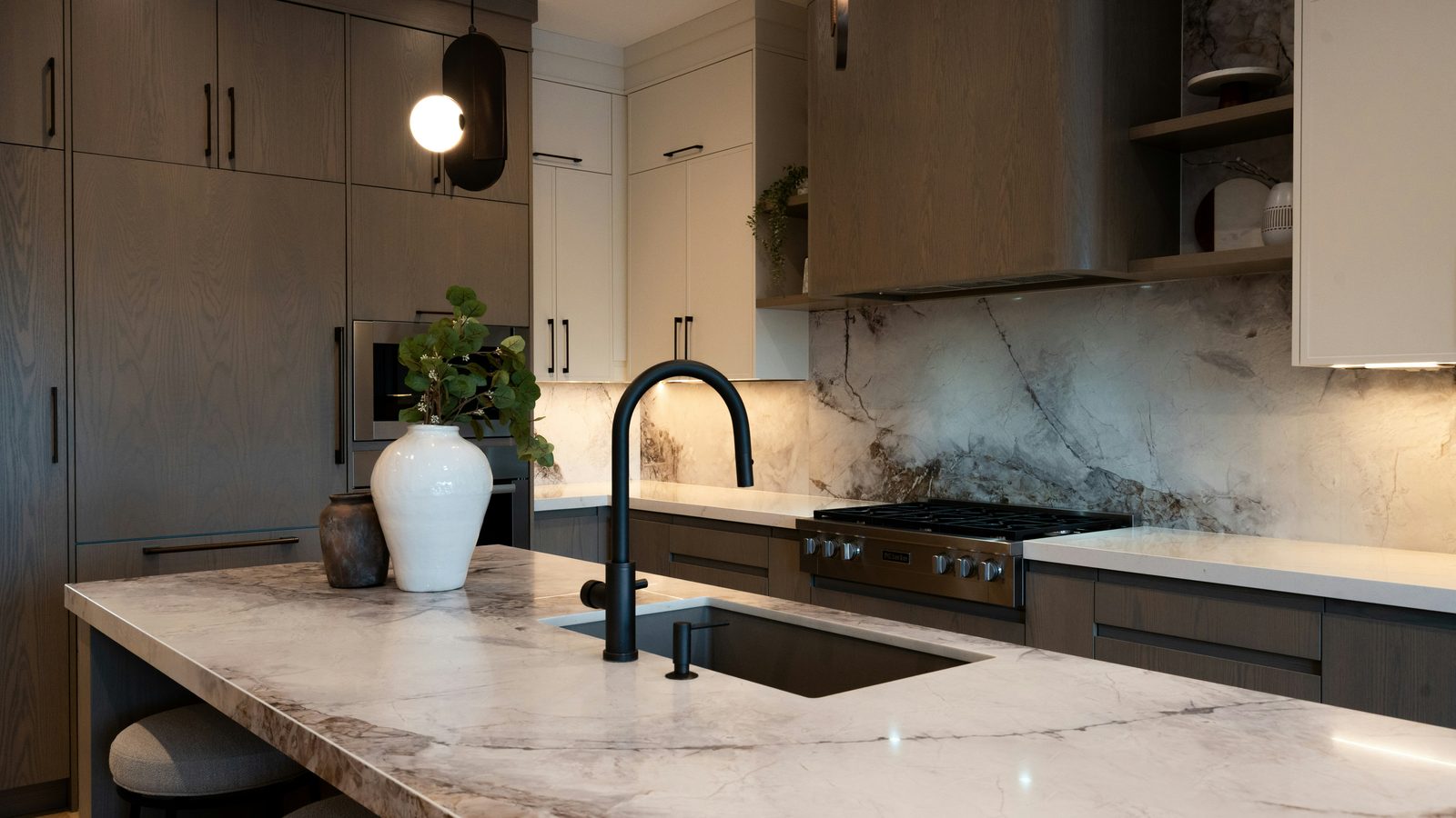 Quartzite island and full-height backsplash